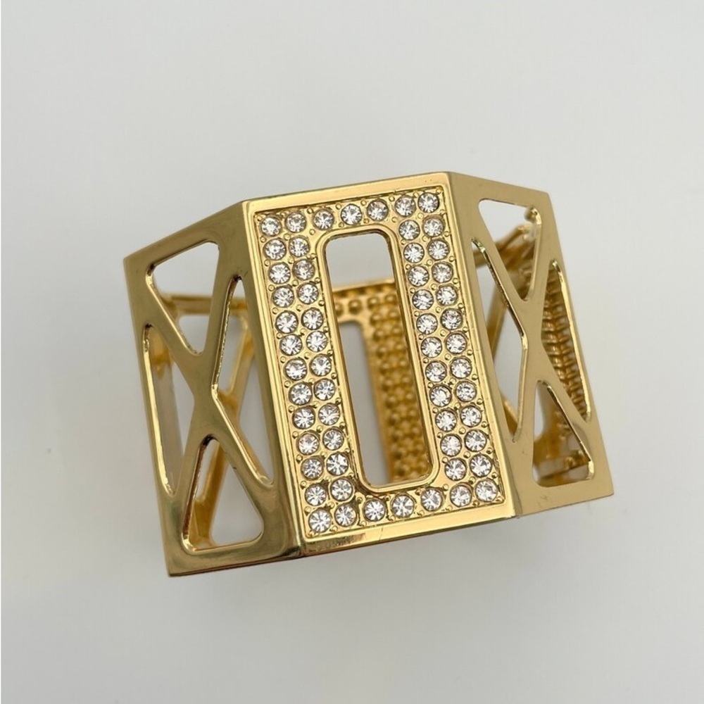 Beautiful modern shiny gold cuff bracelet with rhinestone accents